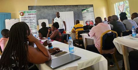 Agro-dealers seated at tables during a capacity-building session in Western Kenya