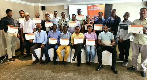 Training of Trainers participants holding their certificates in Addis Ababa